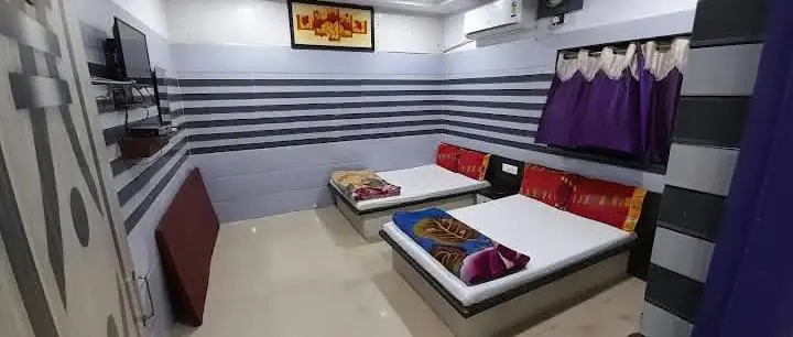 Standard room with two beds, air conditioner and TV
